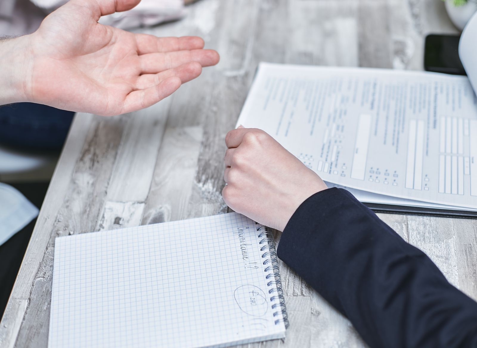 People reviewing documents together at a table